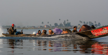Inle, Myanmar - Feb 15, 2016. Speed boat running on Inle (Inlay) lake in Myanmar. Taking a boat is a common way to enter Inle lake area.のeditorial素材