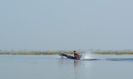 Inle, Myanmar - Feb 15, 2016. Speed boat running on Inle (Inlay) lake in Myanmar. Taking a boat is a common way to enter Inle lake area.のeditorial素材