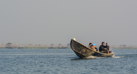 Inle, Myanmar - Feb 15, 2016. Speed boat running on Inle (Inlay) lake in Myanmar. Taking a boat is a common way to enter Inle lake area.のeditorial素材