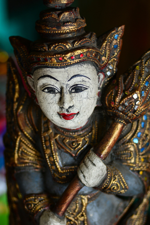 Souvenir (wooden statues) for sale at the shop in Mandalay, Myanmar.のeditorial素材