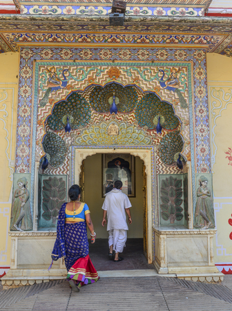 Jaipur, India - Nov 2, 2017. Local people visit the colorful gate of Pritam Niwas Chowk of City Palace. Jaipur, India.のeditorial素材