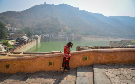 Jaipur, India - Nov 3, 2017. A woman coming to Amber Fort in Jaipur, India. Nostalgic Amber Fort is one of the most well-known and most-visited forts in India.のeditorial素材