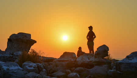 Kien Giang, Vietnam - Dec 11, 2017. A young woman standing on the rock and seeing sunset in Poulo Panjang (Tho Chau Island), South Western Vietnam.のeditorial素材