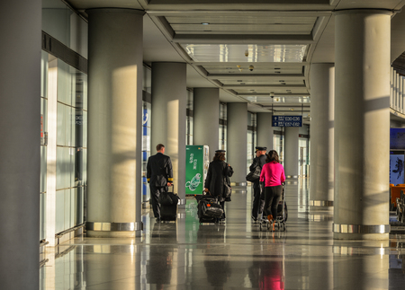 Beijing, China - Feb 28, 2018. Cabin crew walking at Beijing Capital Airport (PEK). It has been the world second busiest airport in terms of passenger traffic.のeditorial素材
