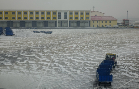 Harbin, China - Feb 28, 2018. Harbin Taiping International Airport in a snowing winter day. Taiping is the largest northernmost airport of China.のeditorial素材