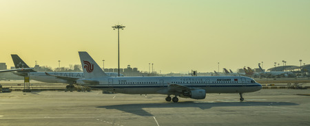 Beijing, China - Feb 28, 2018. Passenger airplanes docking at Beijing Capital Airport (PEK). PEK is...
