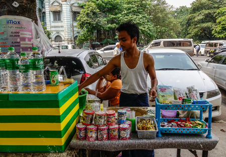 Yangon, Myanmar - Feb 26, 2016. Street vendor cart selling fruit juices in Yangon, Myanmar. Yangon is Myanmar largest city and its most important commercial centre.のeditorial素材