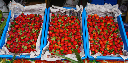 Pahang, Malaysia - Jun 22, 2014. Red strawberry fruits at rural market on Cameron Highlands in Pahang, Malaysia.のeditorial素材
