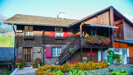 A wooden house in Grindelwald, Switzerland. Grindelwald was one of the first tourist resorts in Europe.のeditorial素材