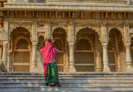 A woman in traditional dress at ancient temple in Jodhpur, India.の写真素材