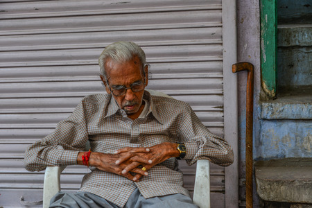 Jodhpur, India - Nov 6, 2017. An old man sleeping on street in Jodhpur, India. Jodhpur is the second largest city in state of Rajasthan.のeditorial素材