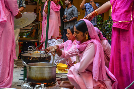 Jodhpur, India - Nov 6, 2017. Women cooking Indian traditional meal in Jodhpur, India. Jodhpur is the second largest city in state of Rajasthan.のeditorial素材