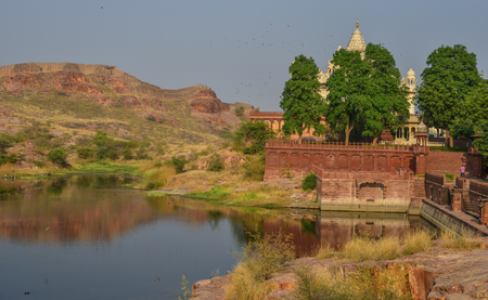 Lake scenery with ancient temple at sunny day in Jodhpur, India.のeditorial素材