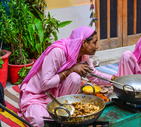 Jodhpur, India - Nov 6, 2017. Women cooking Indian traditional meal in Jodhpur, India. Jodhpur is the second largest city in state of Rajasthan.のeditorial素材