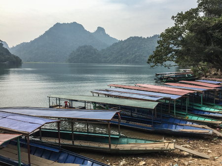Wooden boats at the tourist pier on Ba Be Lake, Bac Kan Province, Vietnam.の写真素材