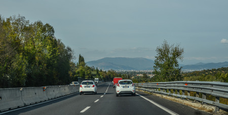Rome, Italy - Oct 13, 2018. Vehicles run on highway in Rome, Italy. The total length of Autostrade (highway in Italy) is about 6,758 kilometres.のeditorial素材