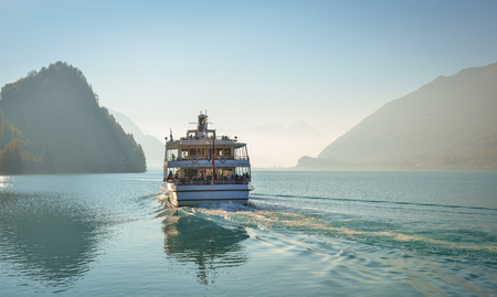 Brienz, Switzerland - Oct 21, 2018. Tourist ferry on the lake in Brienz, Switzerland. The turquoise Lake Brienz is set amid the spectacular mountain scenery.のeditorial素材