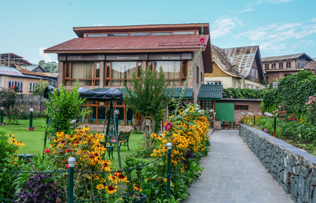 Srinagar, India - Jul 2, 2015. Old villas with flower garden in Srinagar, India. Srinagar is the summer capital of the Indian state of Jammu and Kashmir.のeditorial素材