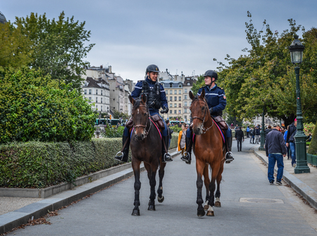 Paris, France - Oct 2, 2018. Gendarmes on horseback in Paris, France. The National Gendarmerie is one of two national police forces of France.のeditorial素材