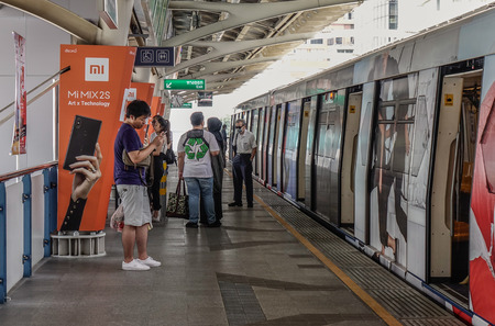 Bangkok, Thailand - Jun 17, 2018. Passengers waiting at BTS Station in Bangkok, Thailand. BTS or Skytrain is one of the most convenient methods to travel around Bangkok.のeditorial素材