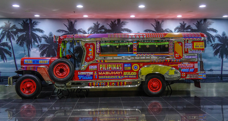 Manila, Philippines - Dec 4, 2018. A Jeepney for display in Manila Airport (NAIA). Jeepneys are buses and the most popular means of public transportation in Philippines.のeditorial素材