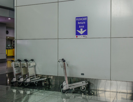 Manila, Philippines - Dec 4, 2018. Trolleys at Departure Hall of Ninoy Aquino International Airport (NAIA) in Manila, Philippines.のeditorial素材