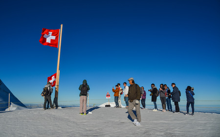 Jungfraujoch, Switzerland - Oct 20, 2018. Beautiful snow Alps Mountain with tourists at Jungfraujoch Station, Switzerland.のeditorial素材