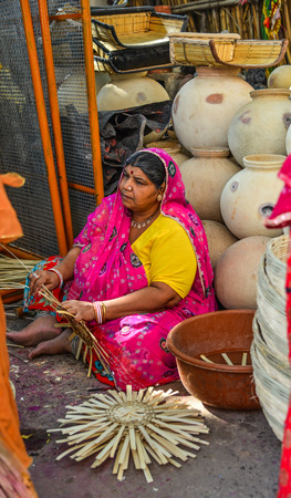 Jodhpur, India - Nov 6, 2017. A woman at pottery shop in Jodhpur, India. Jodhpur is the second largest city in state of Rajasthan.のeditorial素材