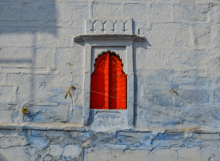 Red window of ancient building in Jodhpur, India.の写真素材
