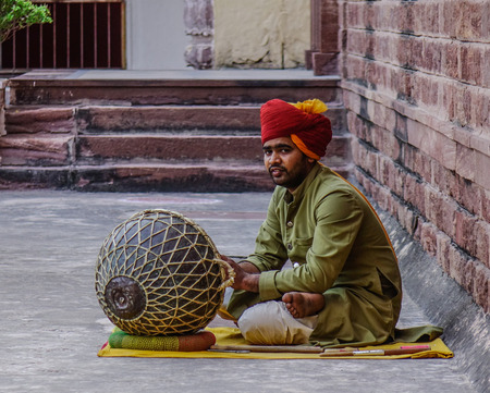 Jodhpur, India - Nov 7, 2017. An unidentified man plays drum at Mehrangarh Fort in Jodhpur, India. Mehrangarh is one of the largest forts in India.のeditorial素材