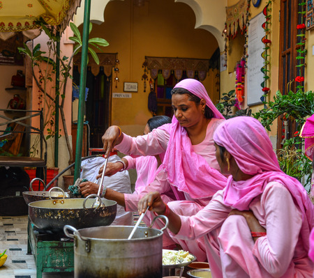 Jodhpur, India - Nov 6, 2017. Indian women cooking traditional food in Jodhpur, India. Jodhpur is a popular tourist destination featuring many palaces forts and temples.のeditorial素材