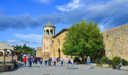 Mtskheta, Georgia - Sep 26, 2018. People visit the main square with Svetitskhoveli Cathedral of...