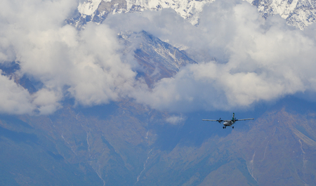 Khopra, Nepal - Oct 25, 2017. A passenger airplane flying over the mountains of Annapurna Massif, Nepal.のeditorial素材