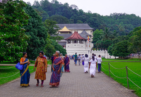 Kandy, Sri Lanka - Dec 15, 2018. White clothed Buddhist devotees visit Temple of the Sacred Tooth Relic in Kandy, Sri Lanka.のeditorial素材