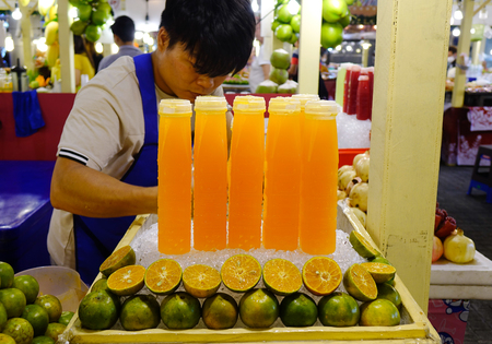 Bangkok, Thailand - Dec 24, 2018. Fresh fruit juice on the counter of the street market in Chinatown, Bangkok, Thailand.のeditorial素材
