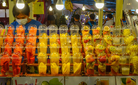 Bangkok, Thailand - Dec 24, 2018. Fresh fruit juice on the counter of the street market in Chinatown, Bangkok, Thailand.のeditorial素材