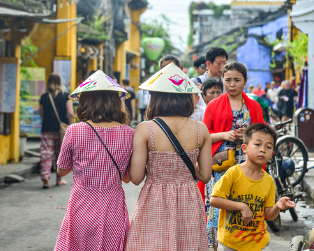 Hoi An, Vietnam - Jan 20, 2019. Tourists walking on street with old houses in Hoi An Ancient Town (Vietnam), a   .のeditorial素材