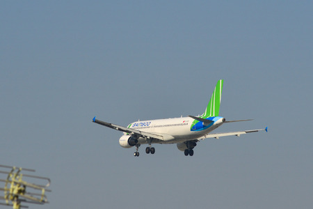 Saigon, Vietnam - Feb 1, 2019. An Airbus A320 airplane of Bamboo Airways landing at Tan Son Nhat...