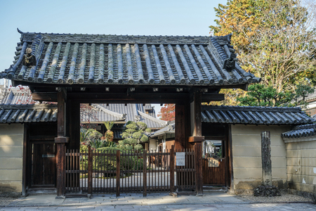 Kyoto, Japan - Nov 18, 2016. Wooden gate of Shinto Shrine in Kyoto, Japan. Kyoto served as Japan capital and the emperor residence from 794 until 1868.のeditorial素材