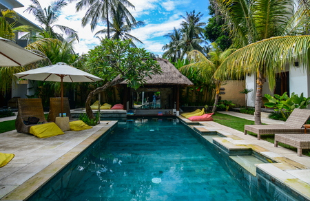 Bali, Indonesia - Apr 20, 2016. Swimming pool of resort in Bali, Indonesia. Bali is a popular tourist destination which has seen a significant rise since the 1980s.のeditorial素材