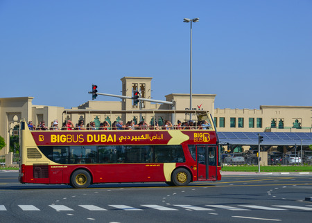 Dubai, UAE - Dec 9, 2018. Big Bus on old street in Dubai. Big Bus Tours is the largest operator of...
