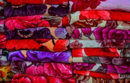 Colorful textile for sale at street market in Yangon, Myanmar.の写真素材