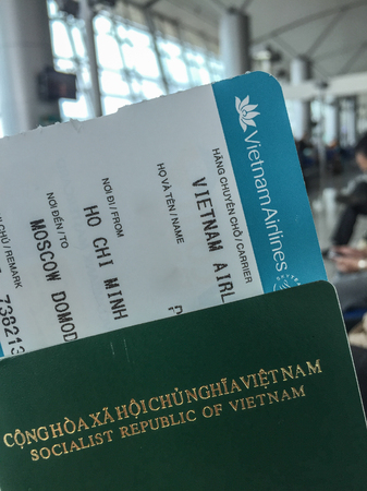 Saigon, Vietnam - Apr 5, 2018. Vietnamese passport with boarding pass of Vietnam Airlines at Tan Son Nhat Airport (SGN).のeditorial素材