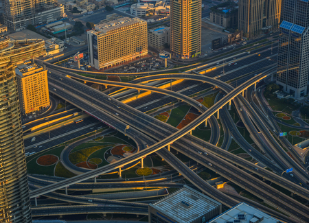 Dubai, UAE - Dec 7, 2018. Aerial view of Dubai City at sunrise. View on the rooftop of Burj Khalifa...