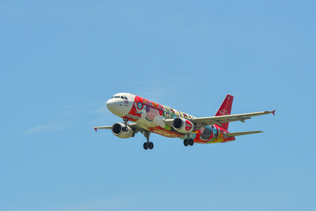 Singapore - Mar 27, 2019. HS-ABD Thai AirAsia Airbus A320 (Amazing Thailand) landing at Changi Airport (SIN).のeditorial素材
