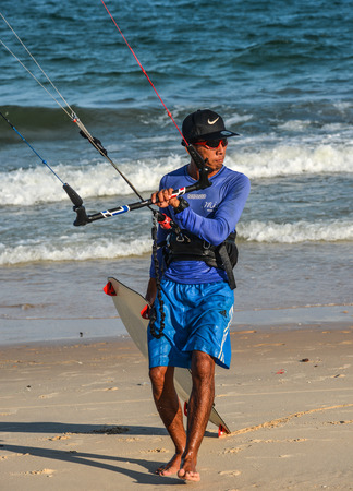 Phan Thiet, Vietnam - May 15, 2018. Playing parasailing on the blue sea at summer day in Mui Ne Town, Phan Thiet, Vietnam.のeditorial素材