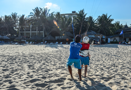 Phan Thiet, Vietnam - May 15, 2018. Playing parasailing on the blue sea at summer day in Mui Ne Town, Phan Thiet, Vietnam.のeditorial素材