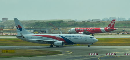 Singapore - Mar 28, 2019. 9M-MLS Malaysia Airlines Boeing 737-800 taxiing on runway of Singapore Changi Airport (SIN).のeditorial素材