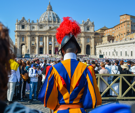 Vatican - Oct 14, 2018. Papal Swiss Guard in uniform at Saint Peter Square. Swiss soldiers are a symbol of attraction in Vatican.のeditorial素材