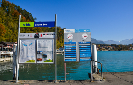 Brienz, Switzerland - Oct 21, 2018. Information boards at tourist jetty in Brienz, Switzerland. Brienz is a beautiful town on the lakeside, attracting many tourists.のeditorial素材
